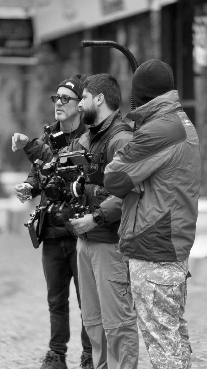 Camera crew huddled together on location