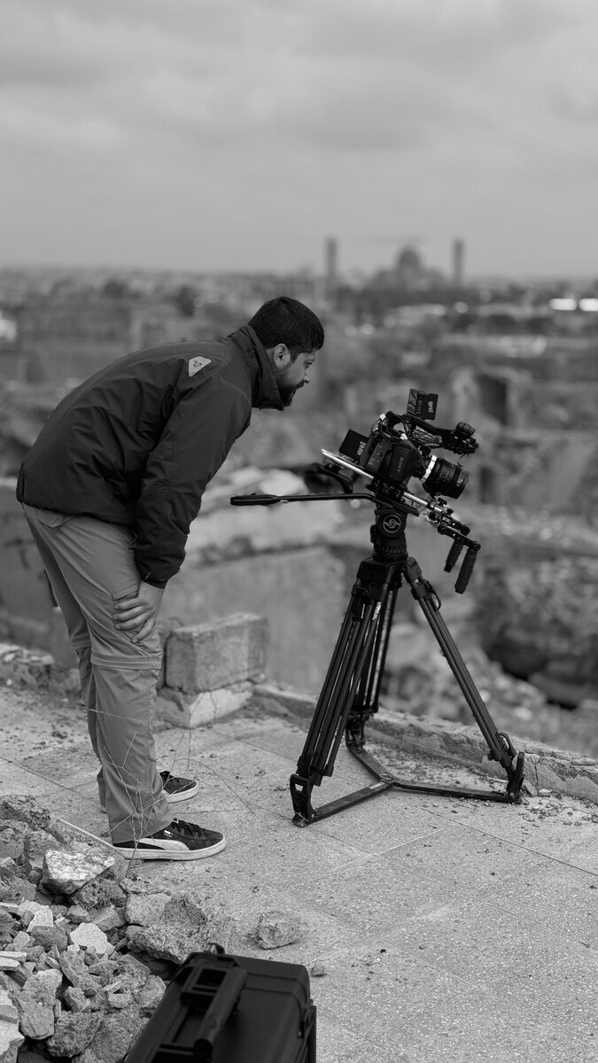 Camera on tripod overlooking the Mosul skyline