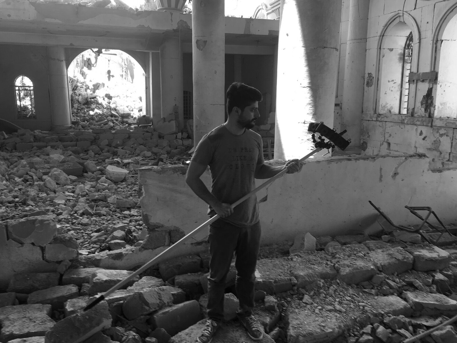 Ayar Rasool with a photogrammetry rig inside a bombed mosque in Mosul